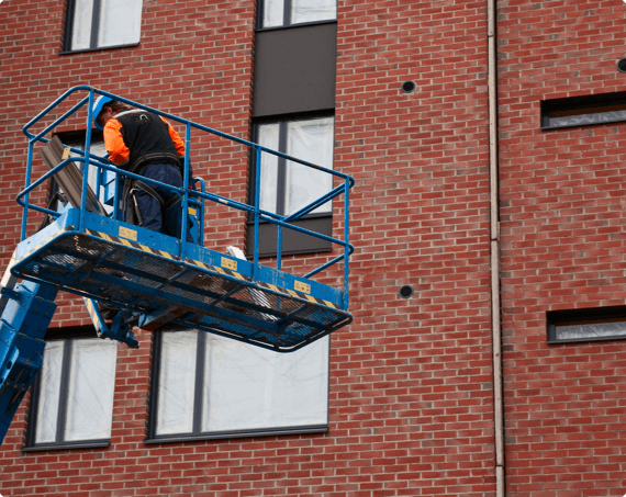 Aerial Lift img 1 A worker on an aerial lift