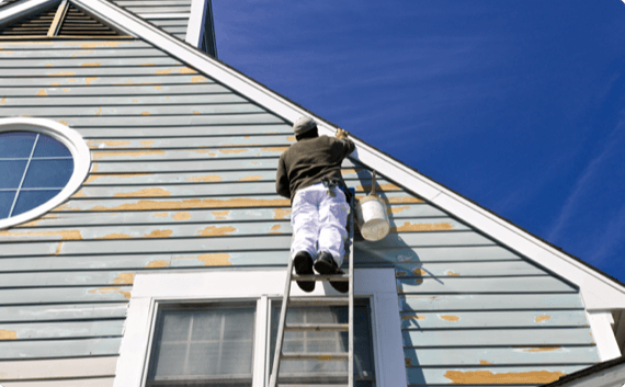 Ladder Safety – french img 1 (1) A man on a ladder paints a home