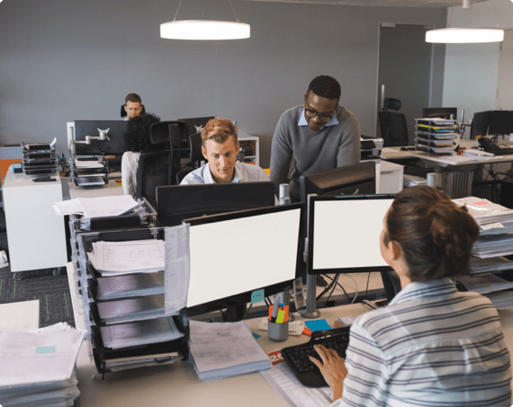 Provincial Safety Committee Training img 1 Office workers collaborating at a desk