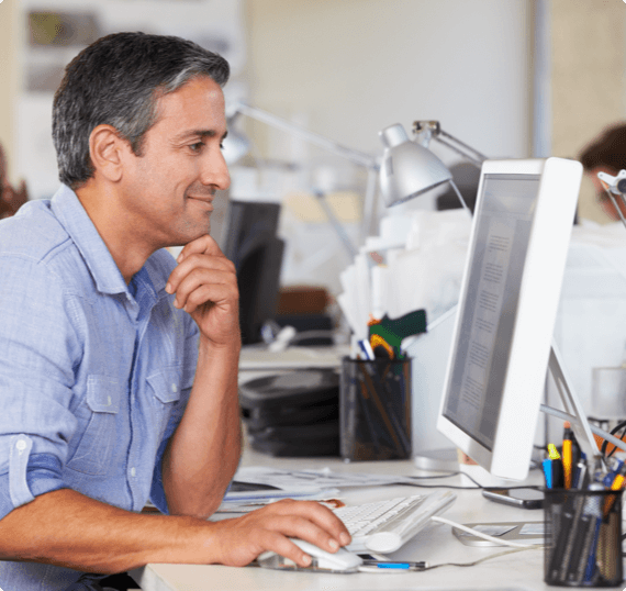 A man works at his ergonomically friendly desk