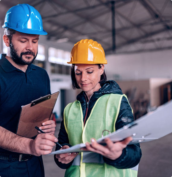 Two site inspectors compare notes