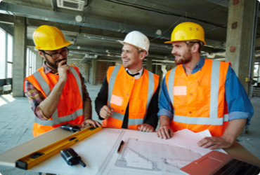 Two workers receive their full supervisor course