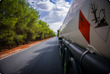 A truck carrying dangerous goods drives on the road
