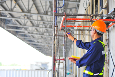 A man inspects a scaffold after receiving his scaffold certification