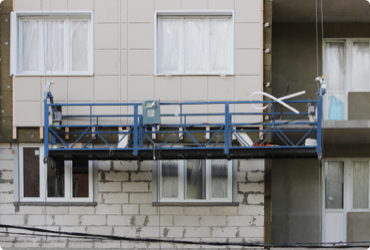 A suspended scaffold on a building