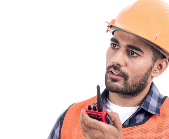 Traffic Control Training worker in hard hat directing traffic at construction site
