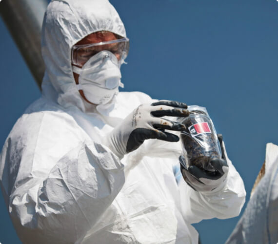 An environmental inspector takes a sample