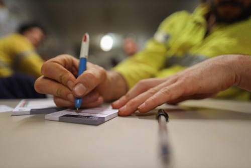 man completes audit job on workplace