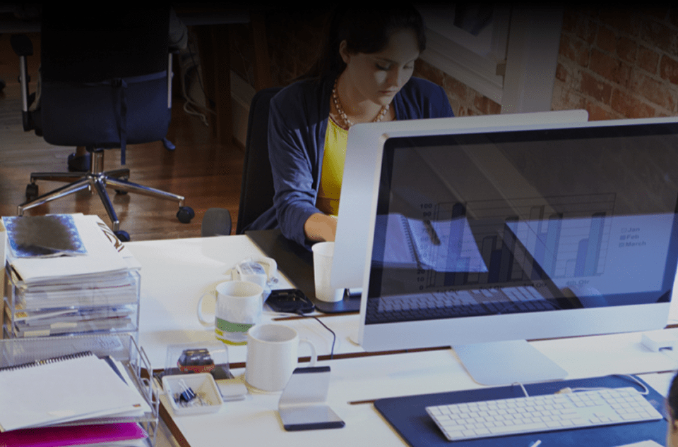 Members of a joint health and safety committee work at their desks