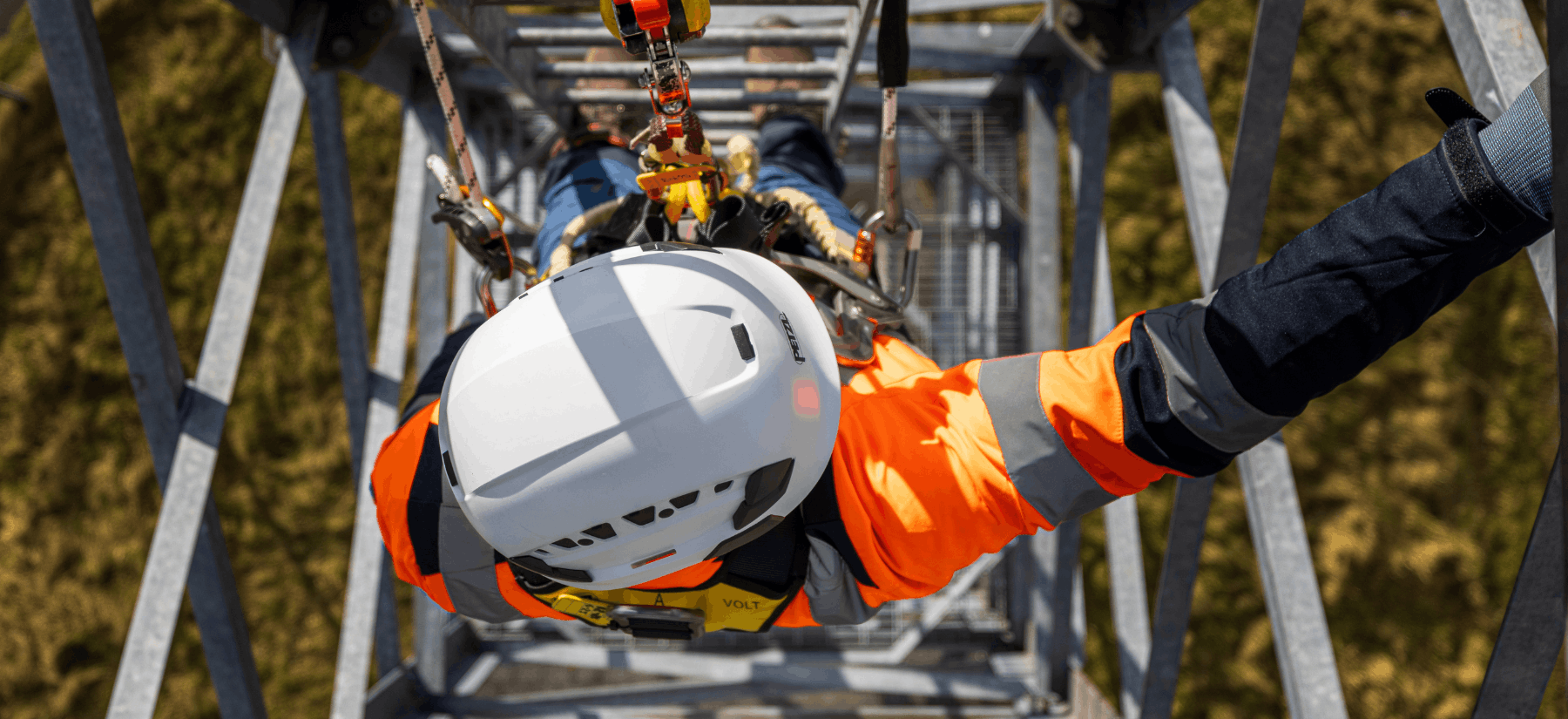 worker climbing a building